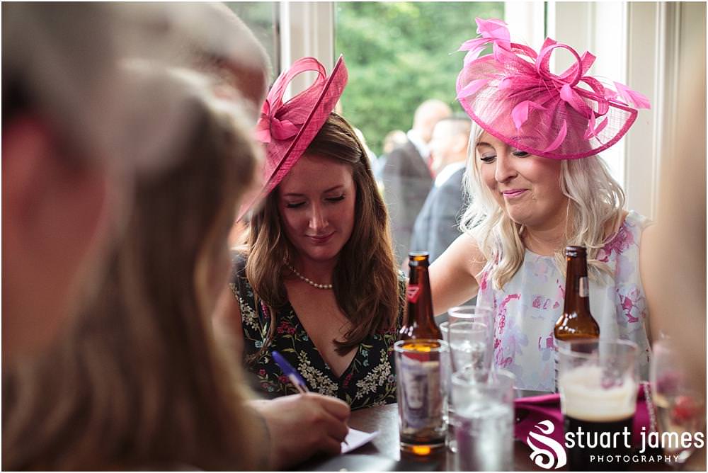 Creative candid photographs capturing the guests enjoying the drinks reception on the lawns at Pendrell Hall with Pendrell Hall Wedding Photography by Stuart James