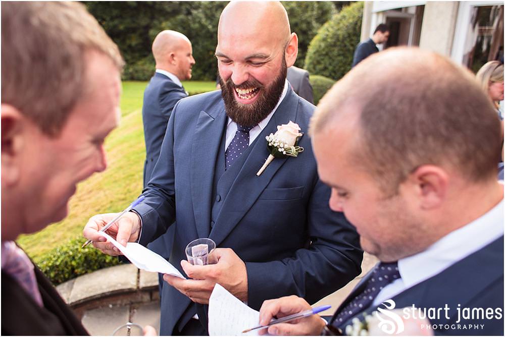 Creative candid photographs capturing the guests enjoying the drinks reception on the lawns at Pendrell Hall with Pendrell Hall Wedding Photography by Stuart James