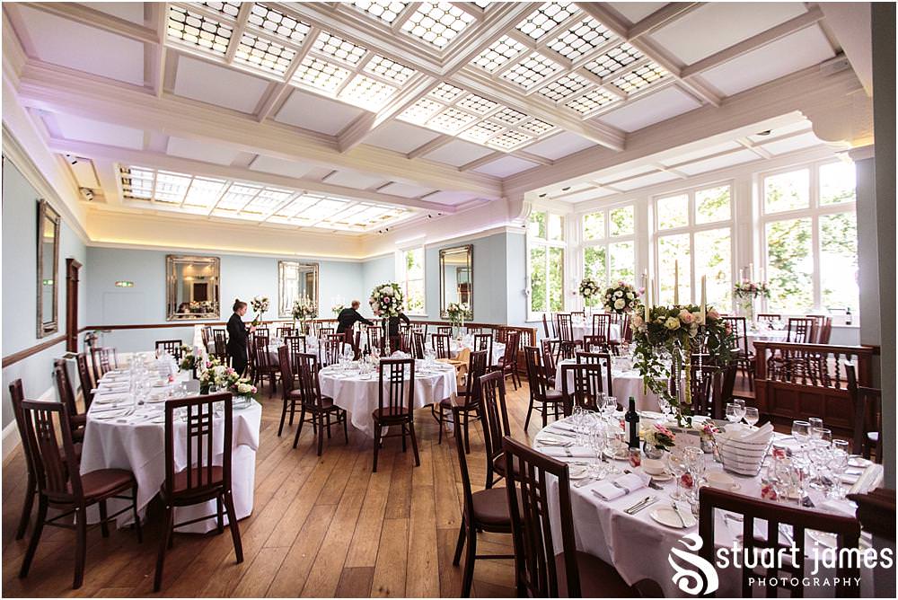 The styling of the wedding breakfast room was simply stunning with amazing floral displays from Entwined Florist at Pendrell Hall with Pendrell Hall Wedding Photography by Stuart James