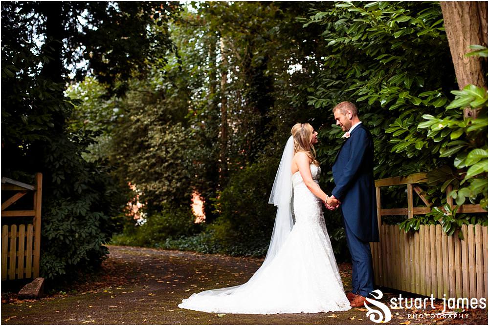 Relaxed evening portraits with our bride and groom on the stunning lawns at Pendrell Hall with Pendrell Hall Wedding Photography by Stuart James