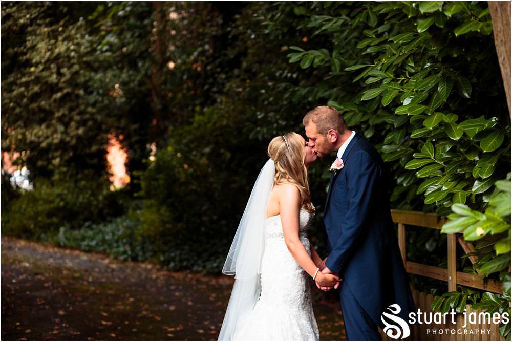Relaxed evening portraits with our bride and groom on the stunning lawns at Pendrell Hall with Pendrell Hall Wedding Photography by Stuart James