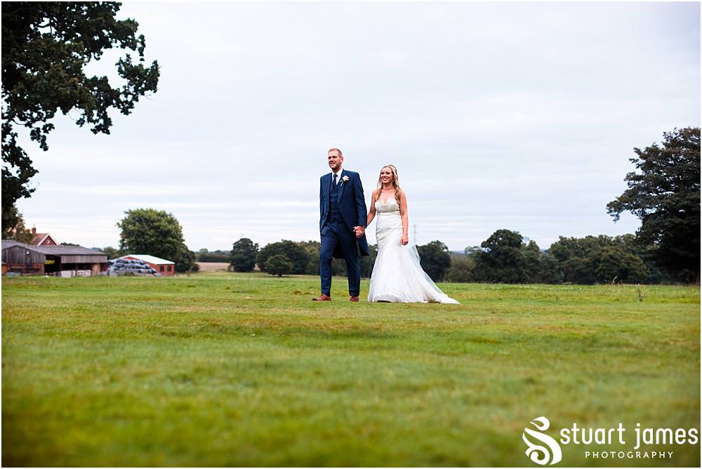 Relaxed evening portraits with our bride and groom on the stunning lawns at Pendrell Hall with Pendrell Hall Wedding Photography by Stuart James