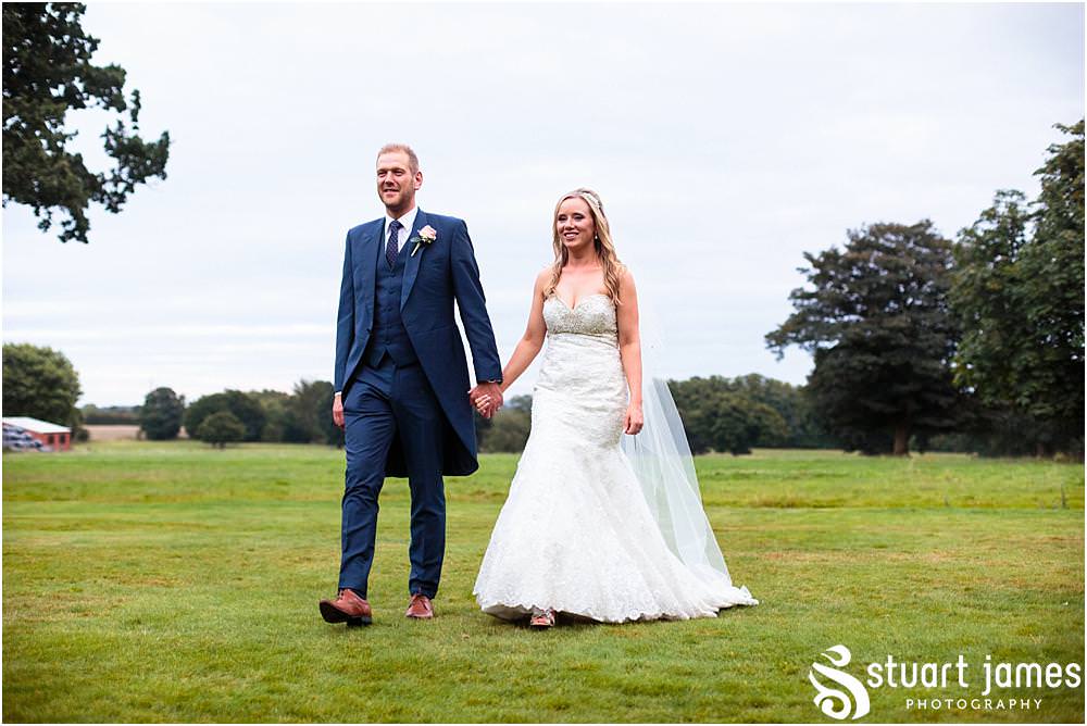 Relaxed evening portraits with our bride and groom on the stunning lawns at Pendrell Hall with Pendrell Hall Wedding Photography by Stuart James