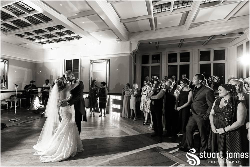 Beautiful first dance for our bride and groom with their son in their arms at Pendrell Hall with Pendrell Hall Wedding Photography by Stuart James