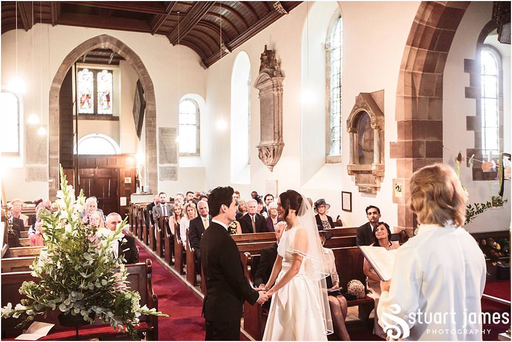 Unobtrusive storytelling photographs showing the wedding ceremony at Weston Park in Shropshire by Shropshire Wedding Photographer Stuart James