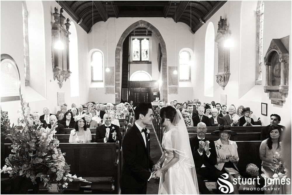 Unobtrusive storytelling photographs showing the wedding ceremony at Weston Park in Shropshire by Shropshire Wedding Photographer Stuart James