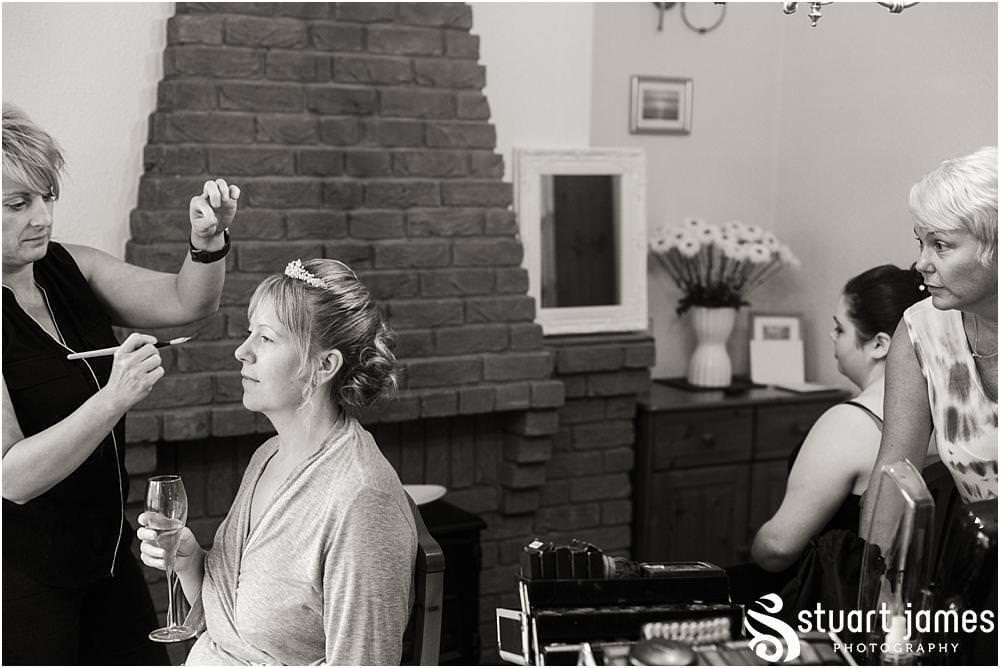 Creative candid photographs of the wedding morning preparations for the bridal party at All Saints Church in Bloxwich by Walsall Wedding Photographers Stuart James