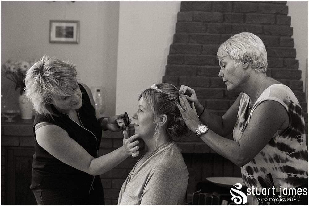 Creative candid photographs of the wedding morning preparations for the bridal party at All Saints Church in Bloxwich by Walsall Wedding Photographers Stuart James