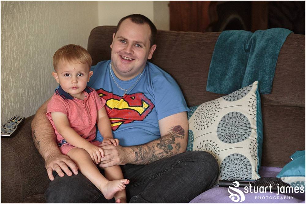 Capturing the relaxed preparations for the groom and groomsmen at home ahead of the wedding at All Saints Church in Bloxwich by Walsall Wedding Photographers Stuart James