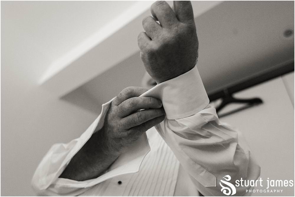 Capturing the relaxed preparations for the groom and groomsmen at home ahead of the wedding at All Saints Church in Bloxwich by Walsall Wedding Photographers Stuart James