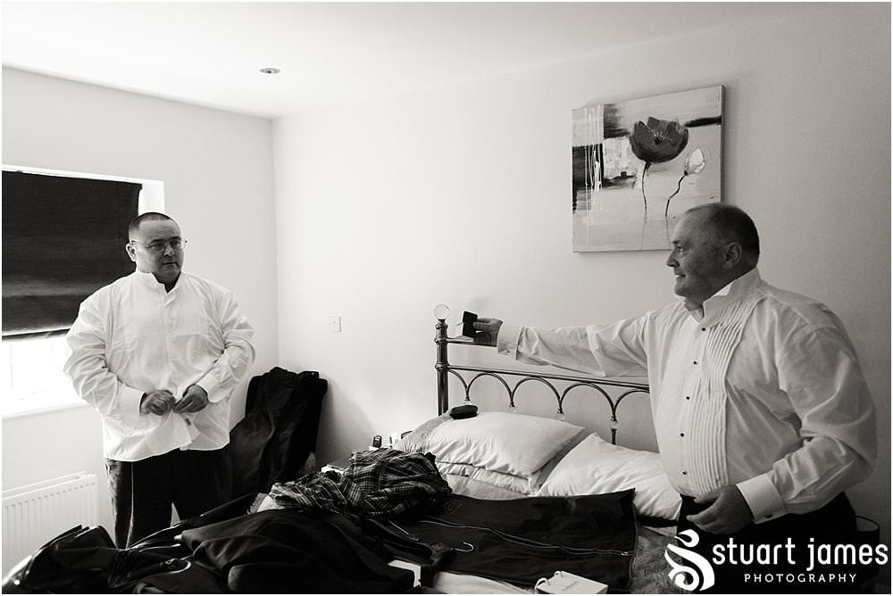 Capturing the relaxed preparations for the groom and groomsmen at home ahead of the wedding at All Saints Church in Bloxwich by Walsall Wedding Photographers Stuart James