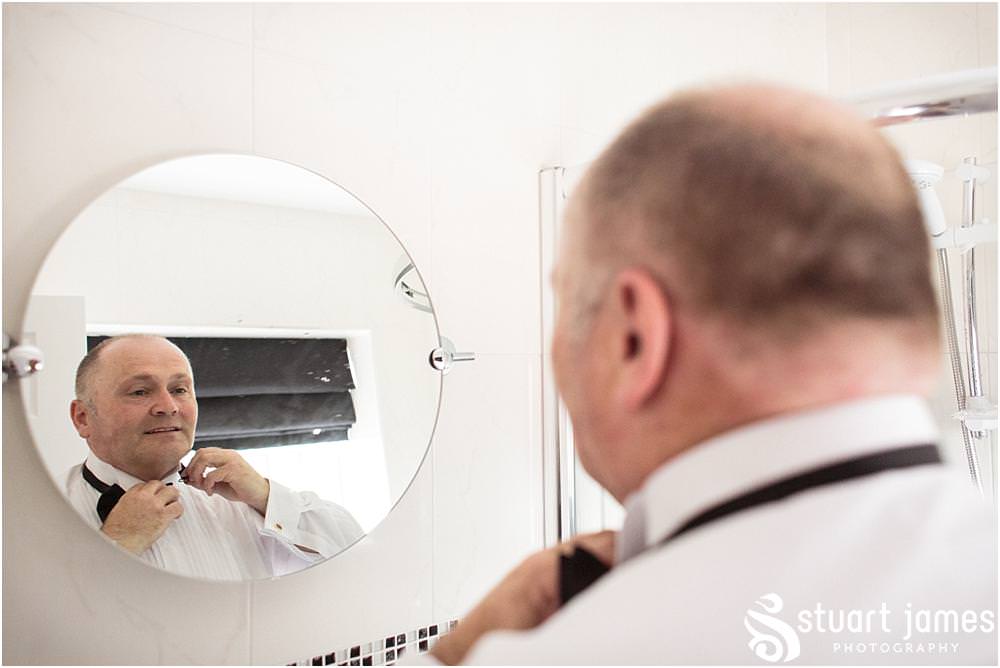Capturing the relaxed preparations for the groom and groomsmen at home ahead of the wedding at All Saints Church in Bloxwich by Walsall Wedding Photographers Stuart James