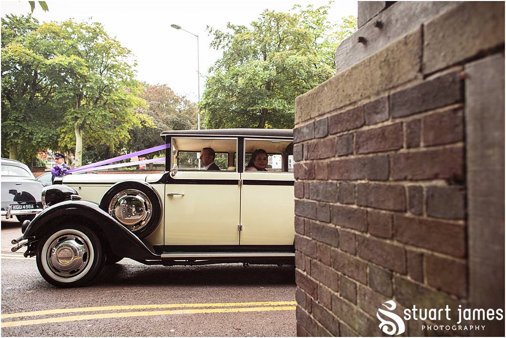 Capturing the excitement as the bride arrives for the wedding ceremony at All Saints Church in Bloxwich by Walsall Wedding Photographers Stuart James