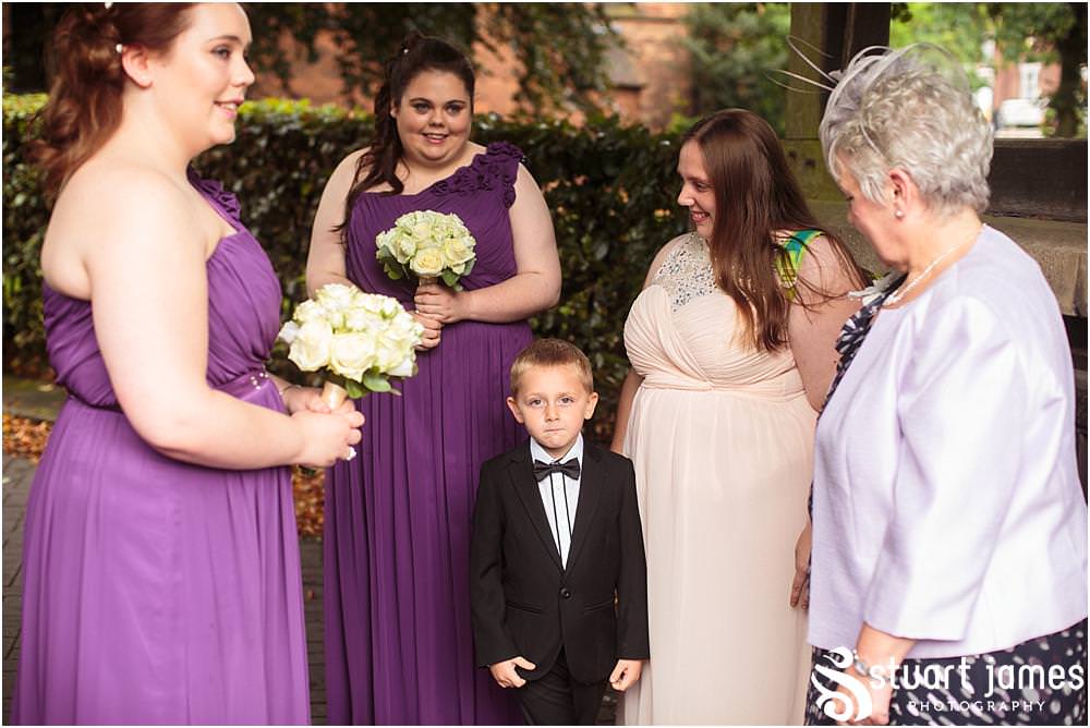 Capturing the excitement as the bride arrives for the wedding ceremony at All Saints Church in Bloxwich by Walsall Wedding Photographers Stuart James