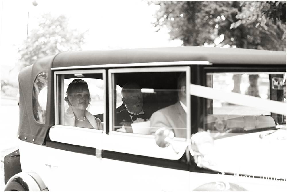 Capturing the excitement as the bride arrives for the wedding ceremony at All Saints Church in Bloxwich by Walsall Wedding Photographers Stuart James