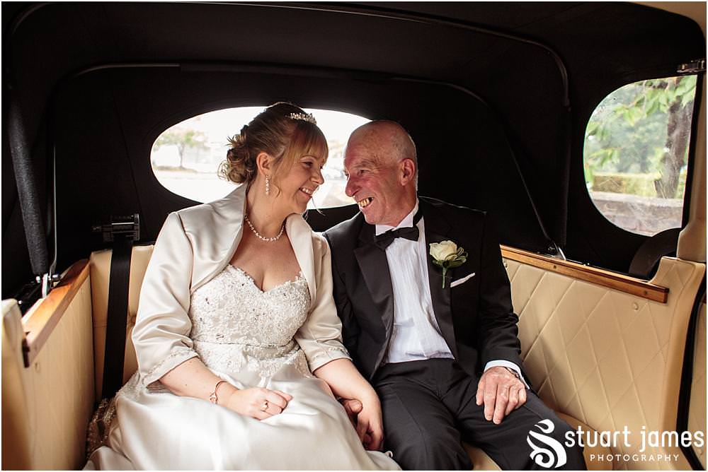 Capturing the excitement as the bride arrives for the wedding ceremony at All Saints Church in Bloxwich by Walsall Wedding Photographers Stuart James