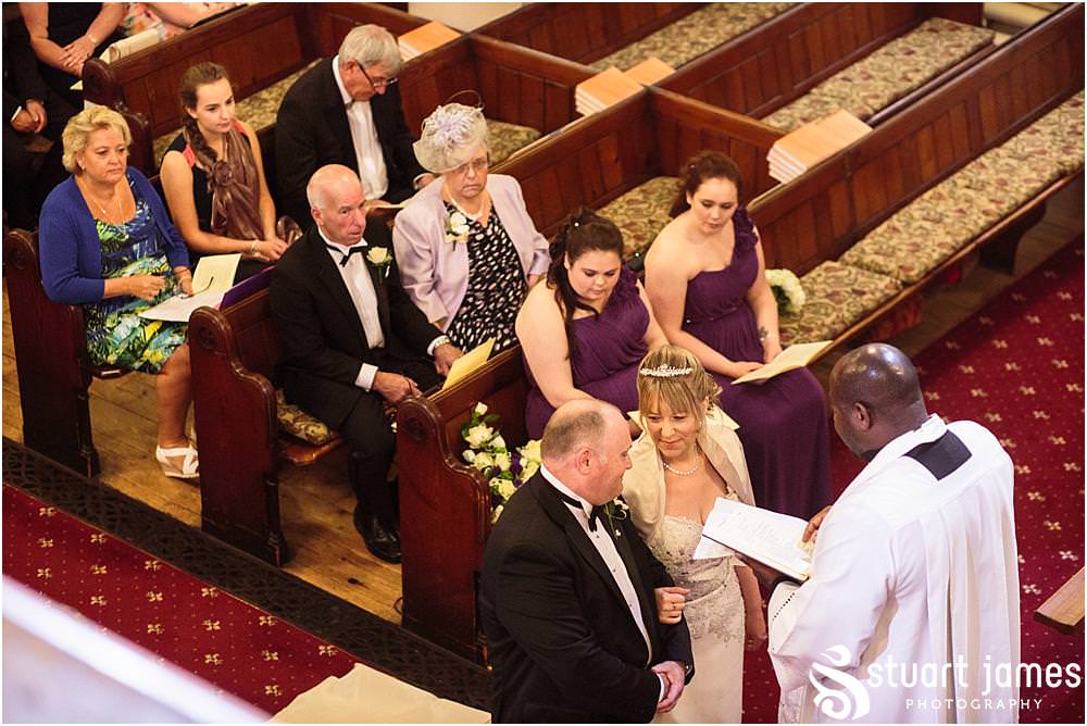 Creative unobtrusive photographs of the wedding ceremony at All Saints Church in Bloxwich by Walsall Wedding Photographers Stuart James