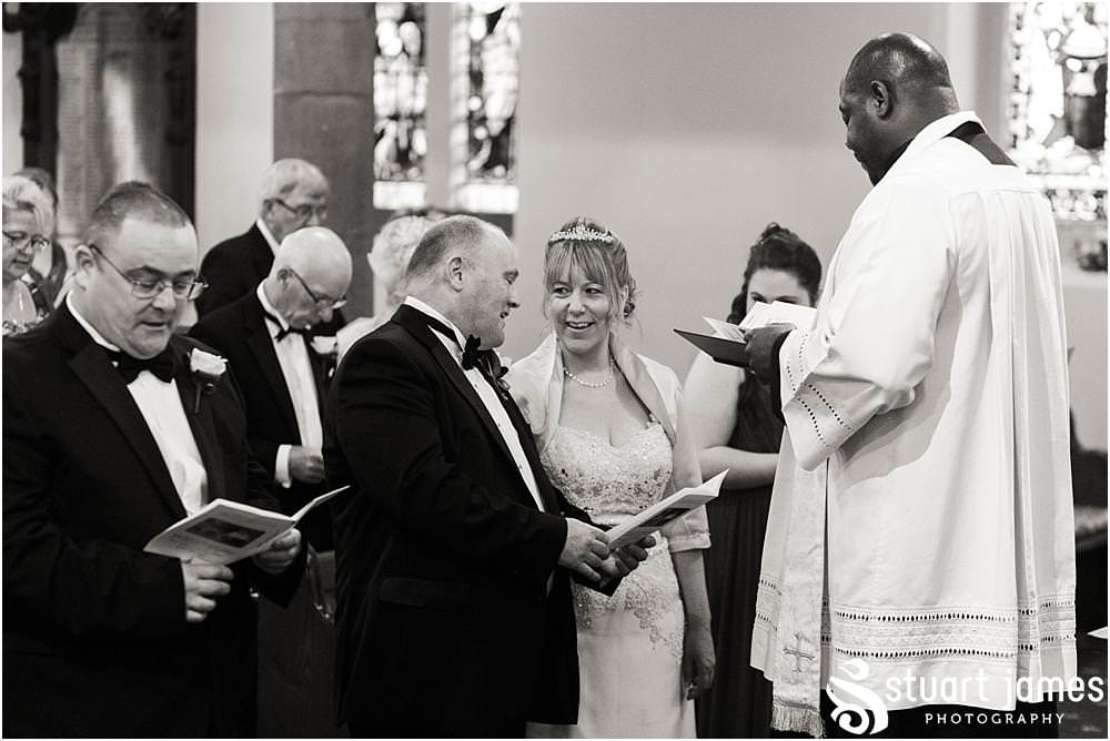 Creative unobtrusive photographs of the wedding ceremony at All Saints Church in Bloxwich by Walsall Wedding Photographers Stuart James