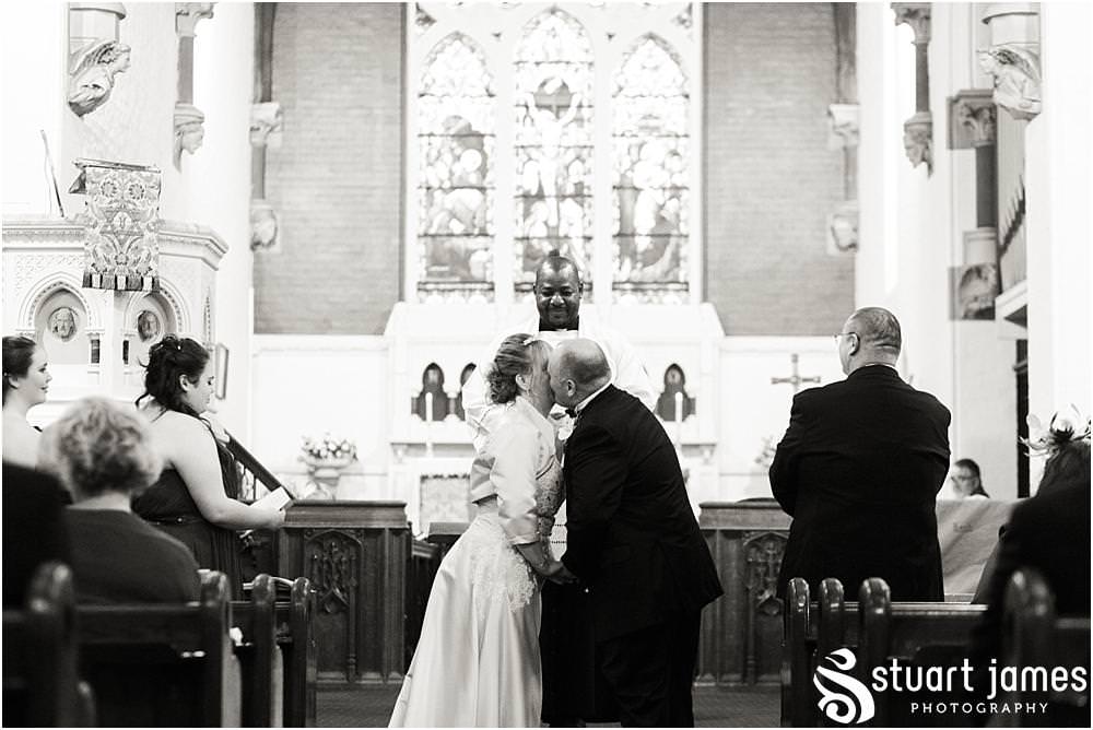 Creative unobtrusive photographs of the wedding ceremony at All Saints Church in Bloxwich by Walsall Wedding Photographers Stuart James