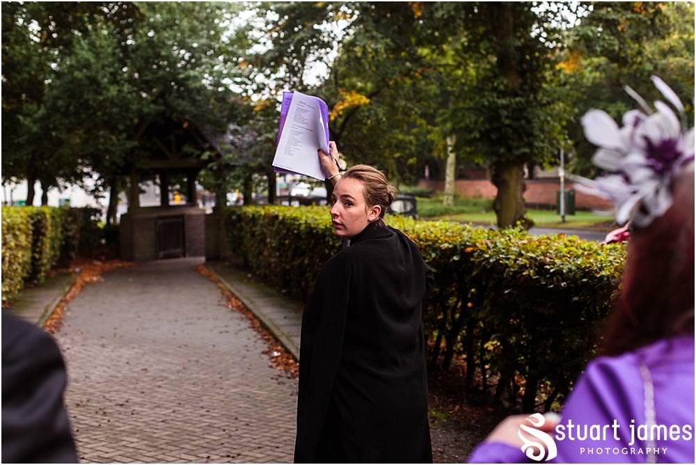 Capturing the excitement as the new Mr & Mrs lead their guests from the church at All Saints Church in Bloxwich by Walsall Wedding Photographers Stuart James