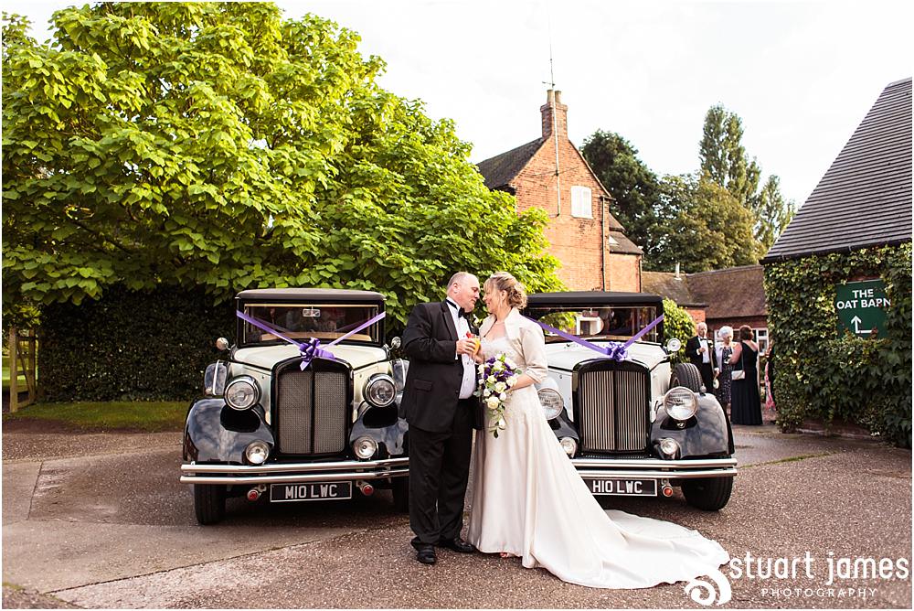 Creative photographs of the bride and groom with their wedding transport at the Barn Wedding Venue in Lichfield by Walsall Wedding Photographers Stuart James