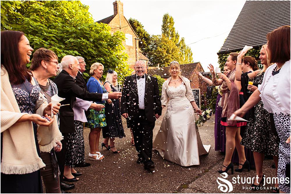 Confetti fun for the wedding party at the Barn Wedding Venue in Lichfield by Walsall Wedding Photographers Stuart James