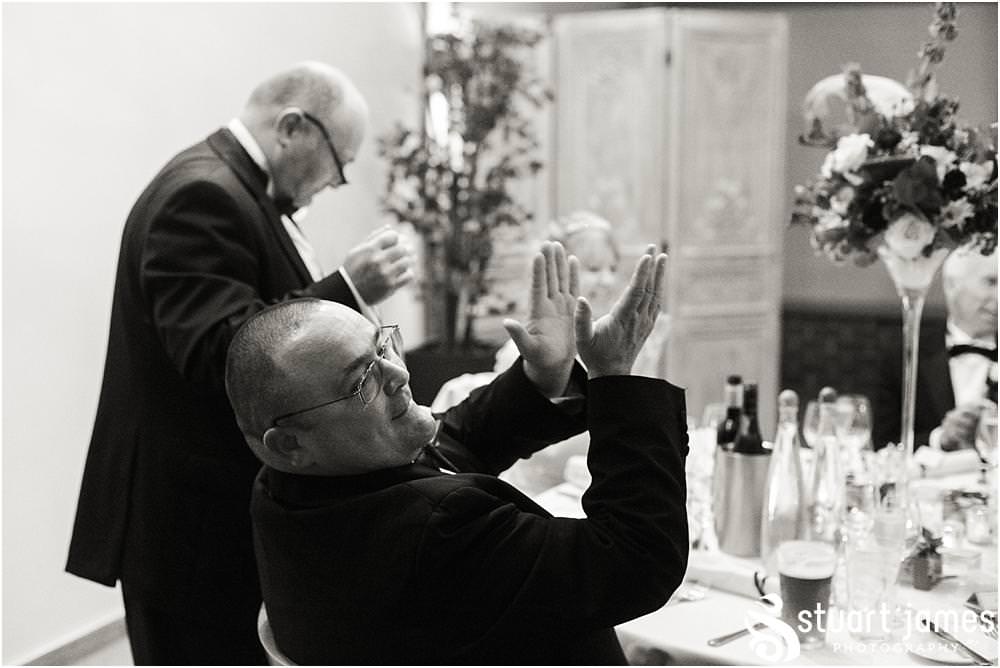 Creative storytelling photographs capturing the speeches and the fabulous emotional and entertaining reactions to the wedding speeches at the Barn Wedding Venue in Lichfield by Walsall Wedding Photographers Stuart James
