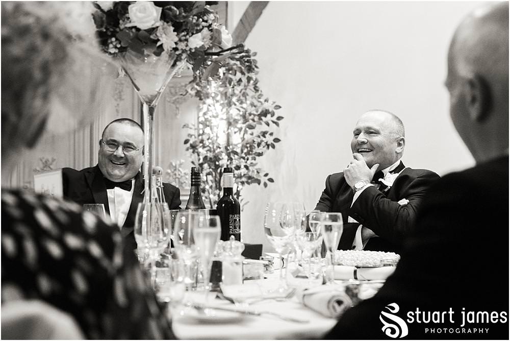 Creative storytelling photographs capturing the speeches and the fabulous emotional and entertaining reactions to the wedding speeches at the Barn Wedding Venue in Lichfield by Walsall Wedding Photographers Stuart James