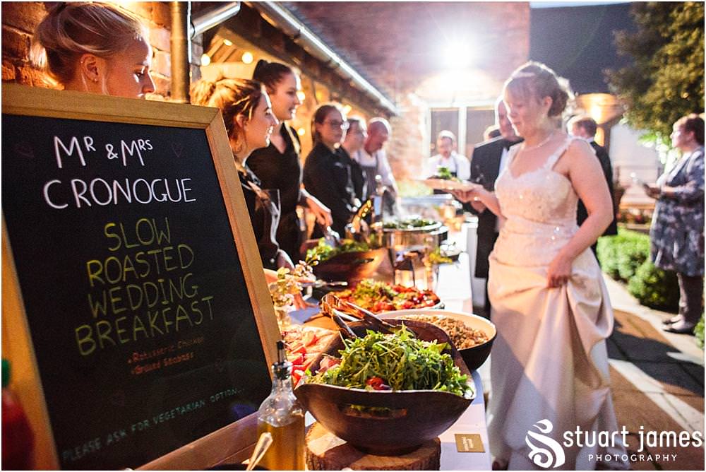 An inspired choice for the wedding breakfast with a slow roasted feast for the guests to enjoy at the Barn Wedding Venue in Lichfield by Walsall Wedding Photographers Stuart James
