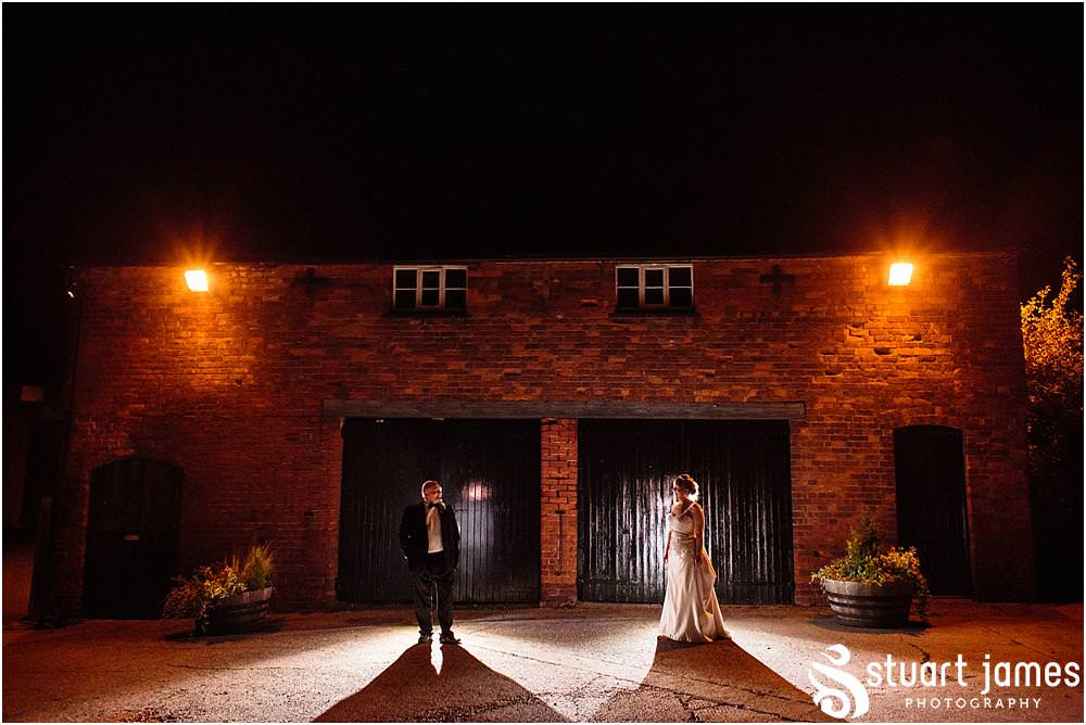 Creative signature nighttime portraits adding the "wow" to the wedding story at the Barn Wedding Venue in Lichfield by Walsall Wedding Photographers Stuart James