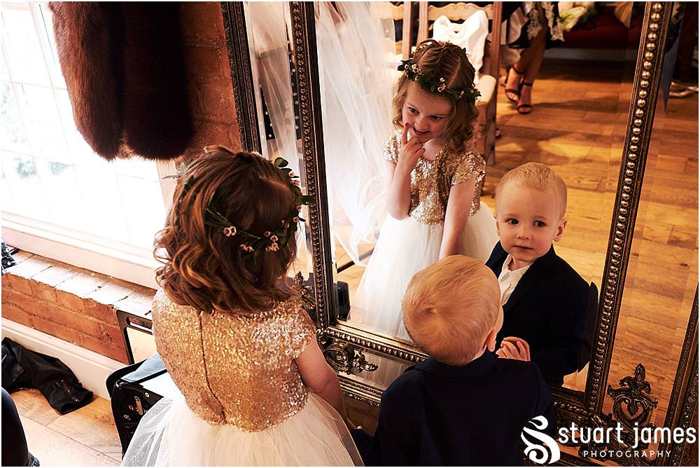 Final moments in the bridal dressing room ahead of the wedding ceremony at The West Mill in Derby by West Mill Wedding Photographers Stuart James