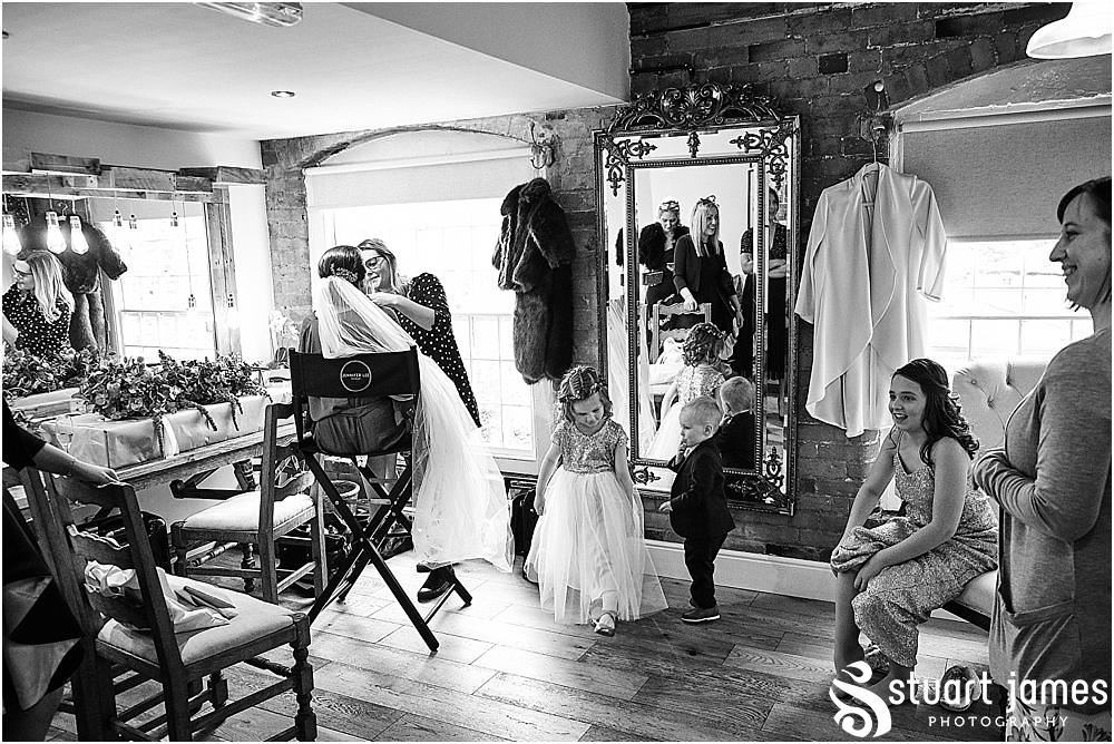Final moments in the bridal dressing room ahead of the wedding ceremony at The West Mill in Derby by West Mill Wedding Photographers Stuart James