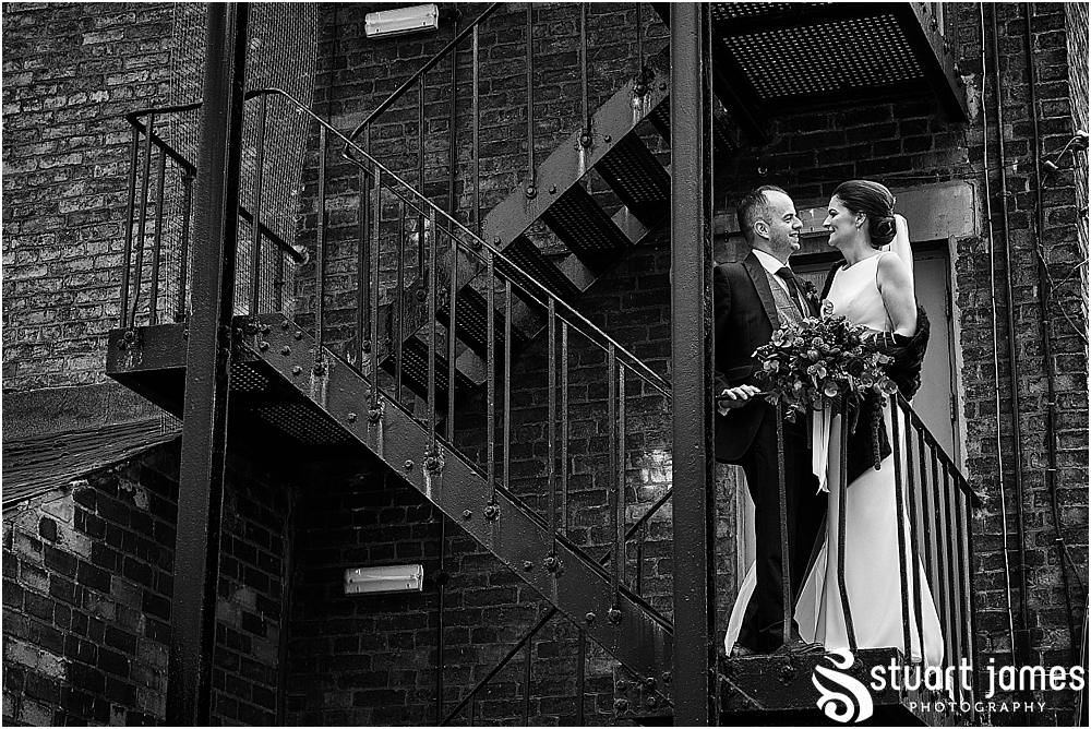 Utilising the industrial setting at The West Mill in Derby for bride and groom portraits by West Mill Wedding Photographers Stuart James
