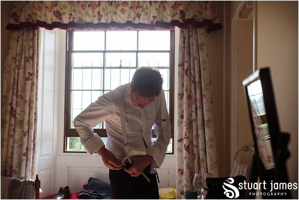 Creative photographs capturing the grooms preparations ahead of the wedding at Davenport House in Shropshire by Davenport House Wedding Photographers Stuart James
