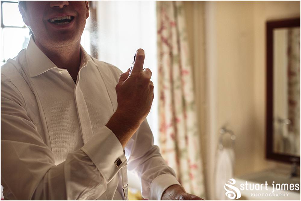 Creative photographs capturing the grooms preparations ahead of the wedding at Davenport House in Shropshire by Davenport House Wedding Photographers Stuart James