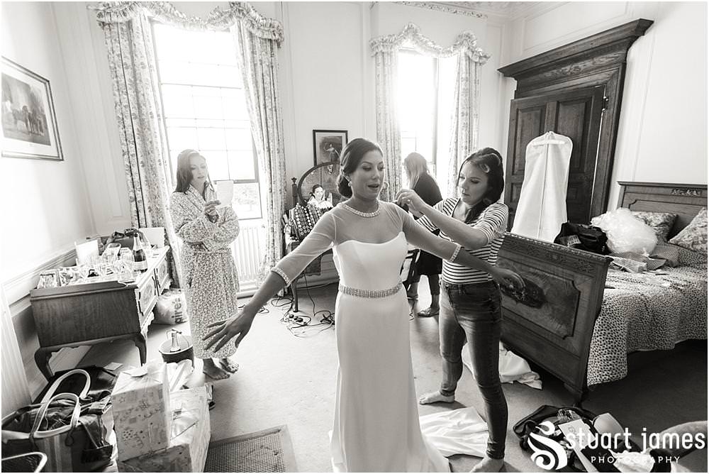 Photos showing the emotion building as our beautiful bride dresses in her gown from Suzanne Neville at Davenport House in Shropshire by Davenport House Wedding Photographers Stuart James