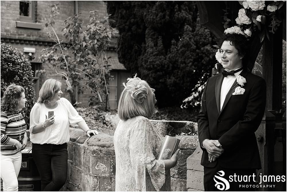 Photographing the arrival of the guests for the wedding ceremony at St Chads Church in Pattingham by Davenport House Wedding Photographers Stuart James