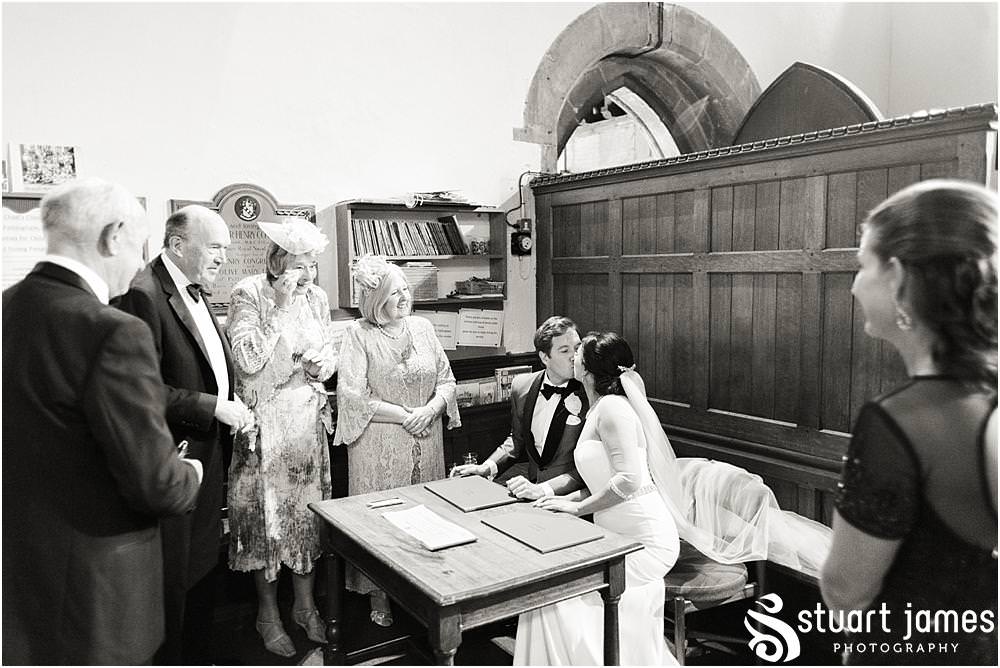 Unobtrusive photographs capturing the beautiful ceremony at St Chads Church in Pattingham by Davenport House Wedding Photographers Stuart James