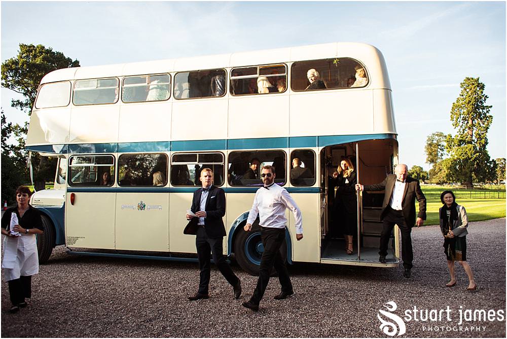 Natural photographs capturing the guests enjoying the drinks reception in the sun at Davenport House in Shropshire by Davenport House Wedding Photographers Stuart James