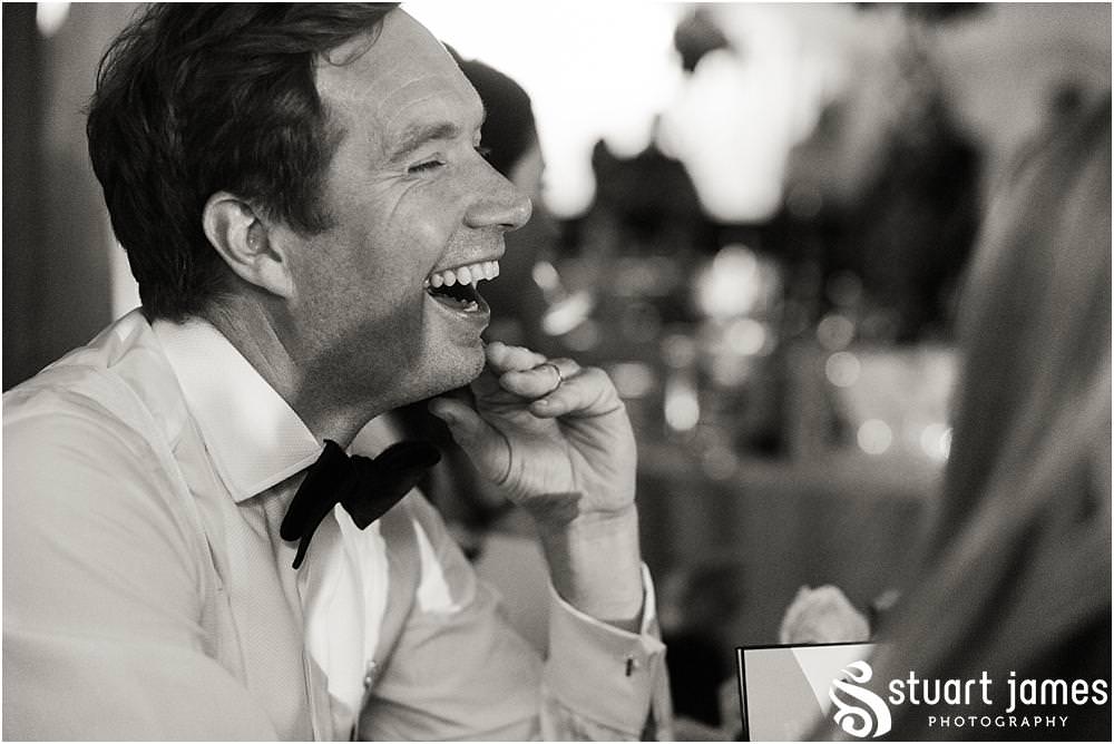 Creative candid photographs capturing the fabulous reactions to the wedding speeches at Davenport House in Shropshire by Davenport House Wedding Photographers Stuart James