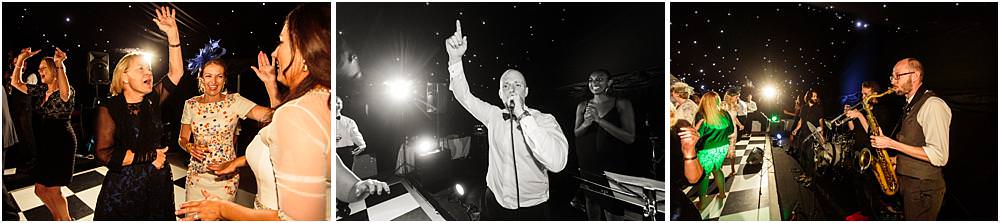 Live music from Low Riders Band really getting the wedding reception into fabulous style at Davenport House in Shropshire by Davenport House Wedding Photographers Stuart James