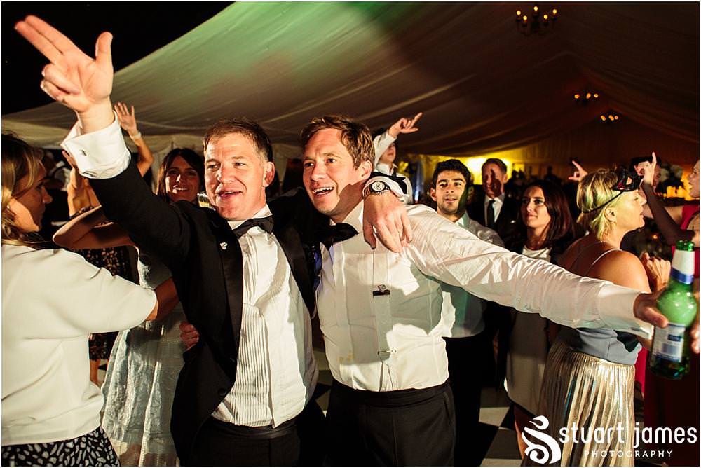 Photos showing the truly amazing night as the guests get down and party at Davenport House in Shropshire by Davenport House Wedding Photographers Stuart James