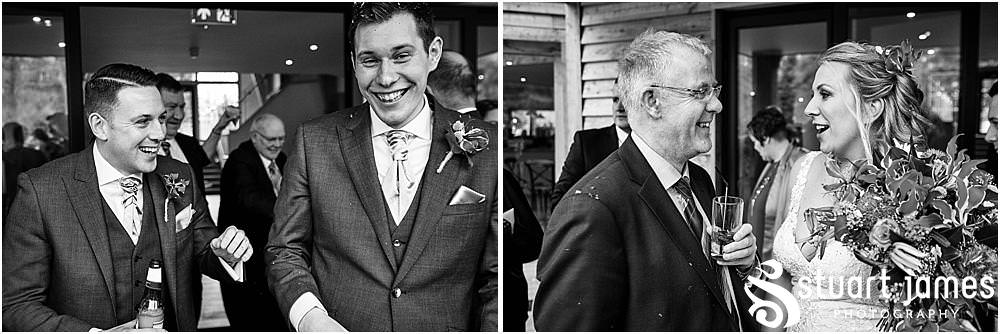 Confetti attack for the new Mr and Mrs as they make their exit at The Mill Barns in Alveley by Mill Barns Wedding Photographers Stuart James