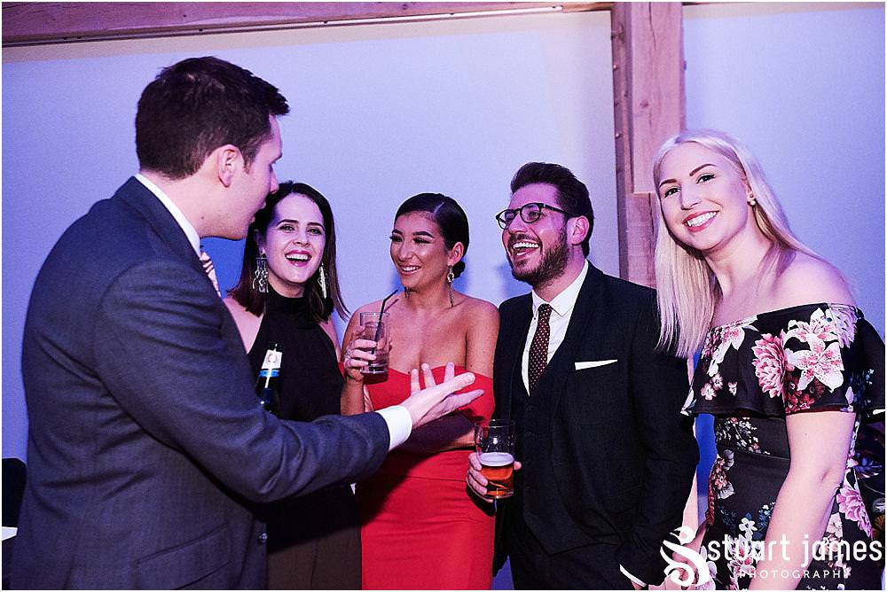Capturing the fun of the evening getting underway for the wedding guests at The Mill Barns in Alveley by Mill Barns Wedding Photographers Stuart James