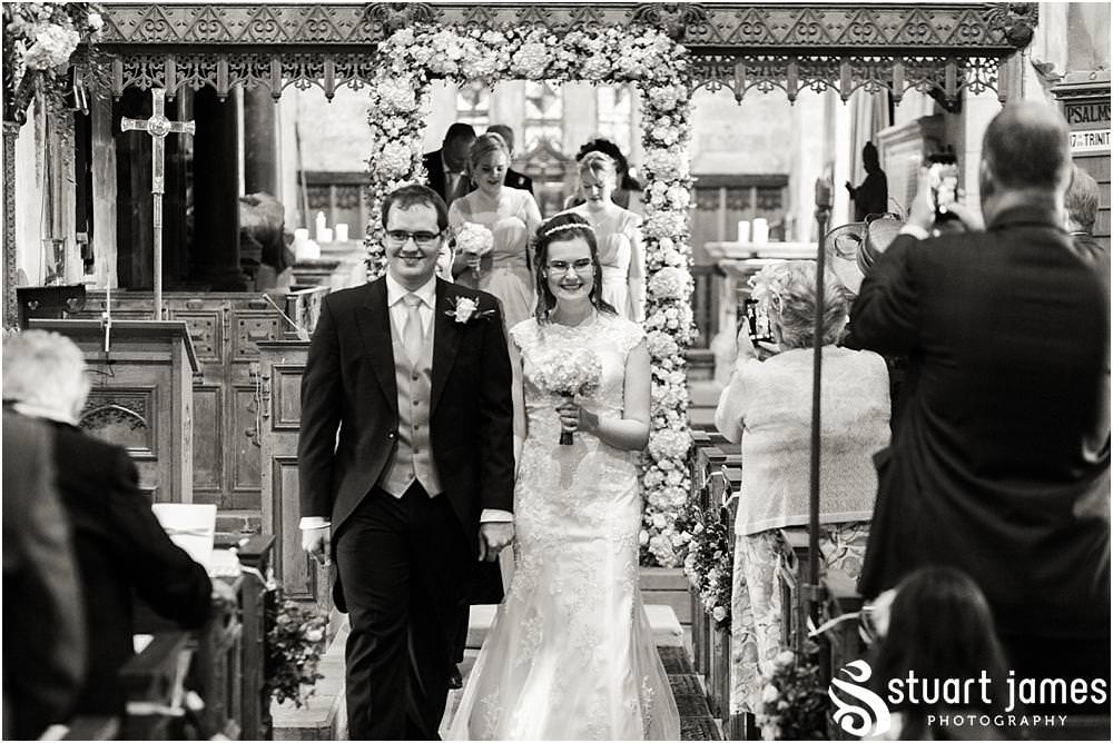 Unobtrusive storytelling photographs of the wedding ceremony at All Saints Church, Sandon Hall in Stafford by Sandon Wedding Photographers Stuart James