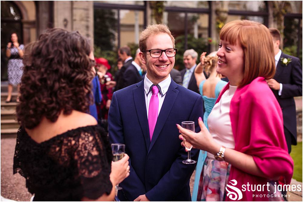 Creative candid photographs capturing the hilarity of the garden games as the guests enjoy the drinks reception at Sandon Hall in Stafford by Sandon Wedding Photographers Stuart James