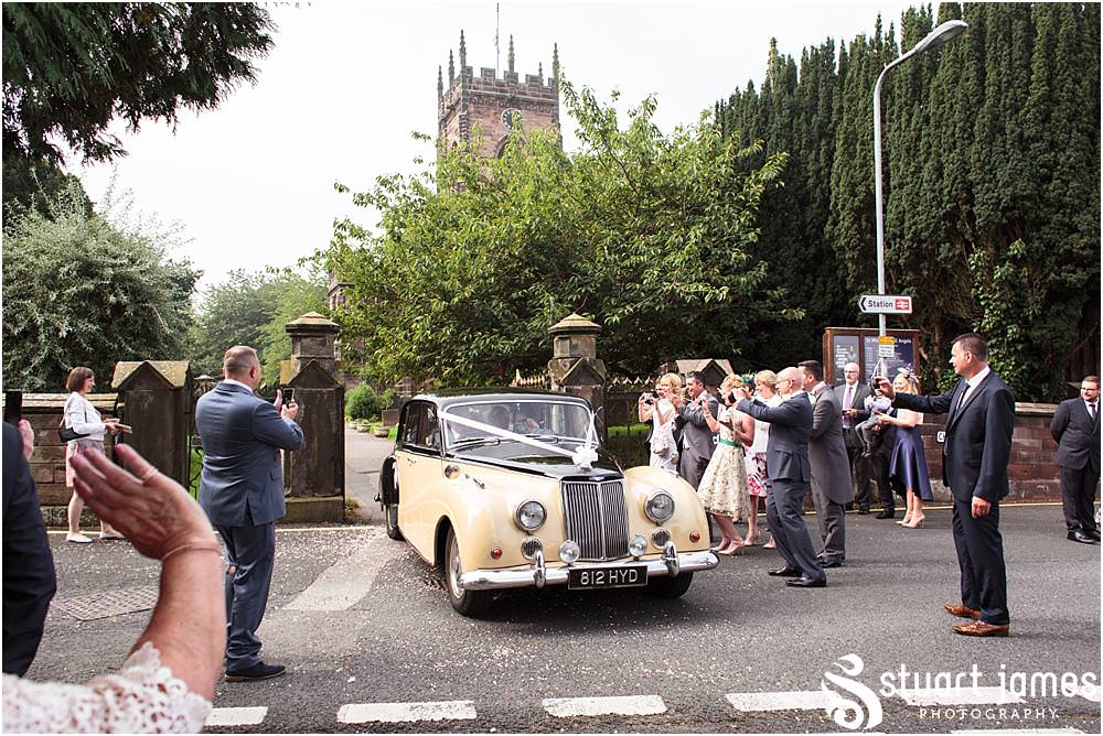 Beautiful scenes captured as the guests greet the Bride and Groom at St Michaels Church in Penkridge by Wedding Photographer Penkridge - Documentary Wedding Photographer Stuart James