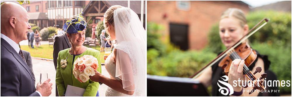 Creative candid photographs showing the wedding guests enjoying the reception at The Moat House in Acton Trussell by Wedding Photographer Penkridge - Documentary Wedding Photographer Stuart James