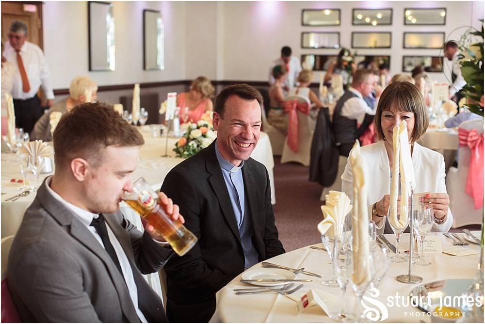 Creative candid photographs showing the wedding guests enjoying the reception at The Moat House in Acton Trussell by Wedding Photographer Penkridge - Documentary Wedding Photographer Stuart James