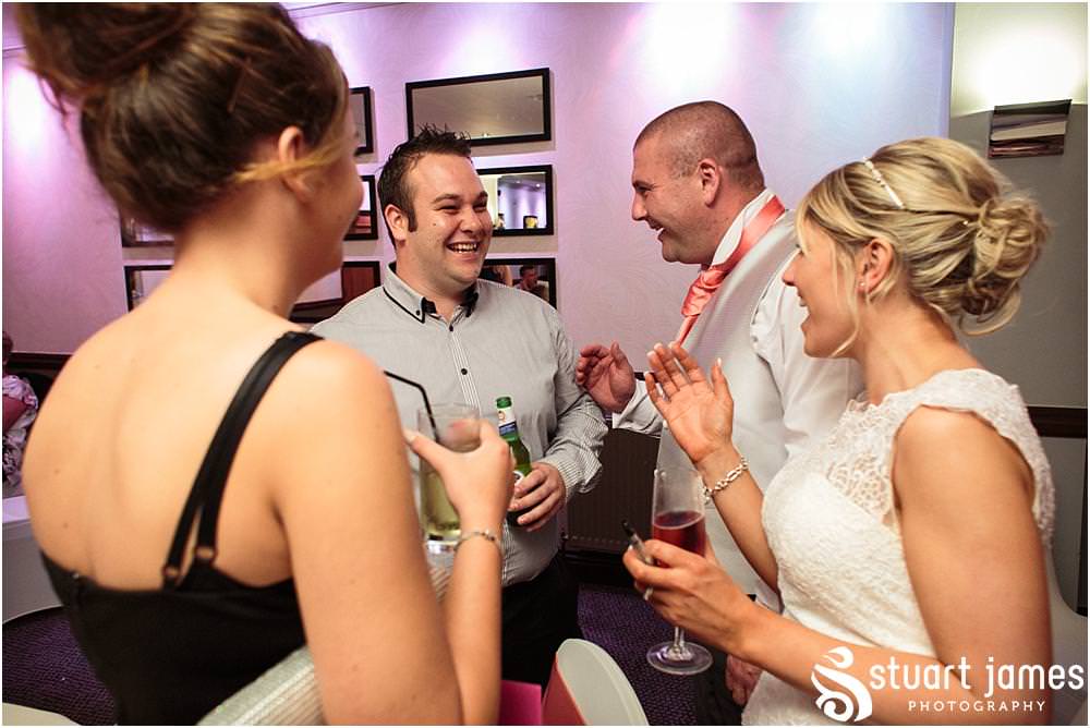 Capturing the wonderful reception as the guests enjoy the wedding evening at The Moat House in Acton Trussell by Wedding Photographer Penkridge - Documentary Wedding Photographer Stuart James